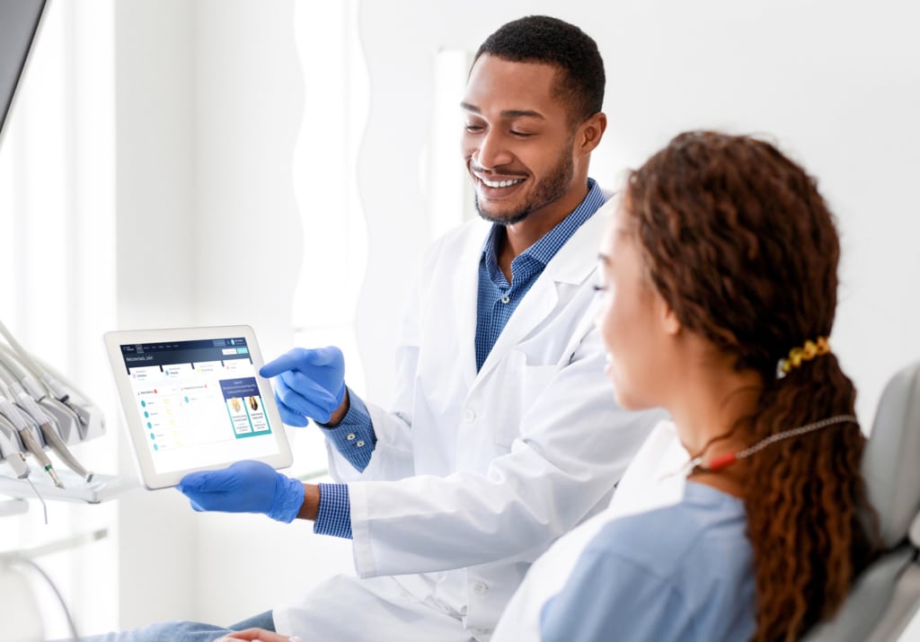 Dentist showing Plan Forward software to a patient